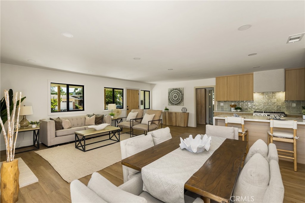 2680 Chatwin Avenue Long Beach, CA 90815 - Photo 23 of 61 a living room with furniture and a wooden floor