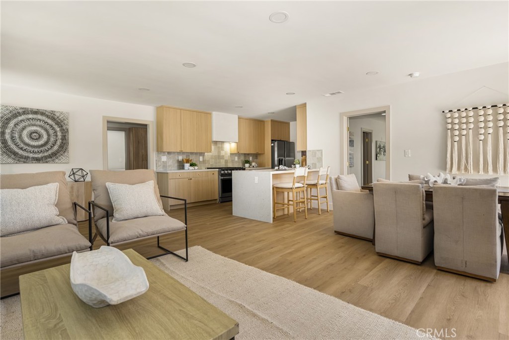 2680 Chatwin Avenue Long Beach, CA 90815 - Photo 25 of 61 a living room with furniture and a table