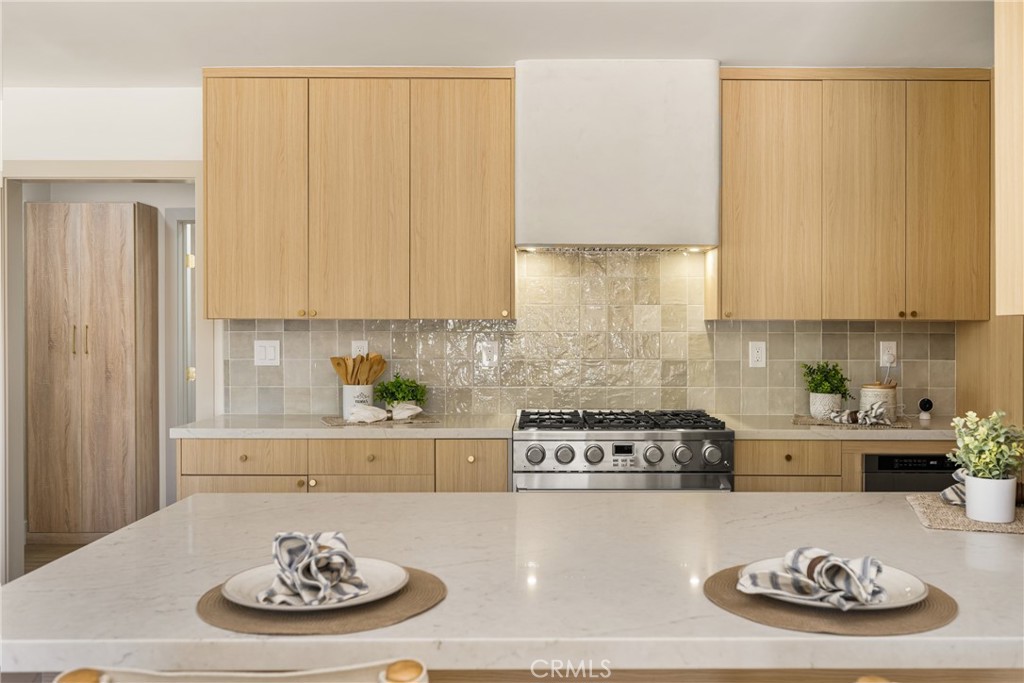 2680 Chatwin Avenue Long Beach, CA 90815 - Photo 29 of 61 a kitchen with a refrigerator and a stove top oven