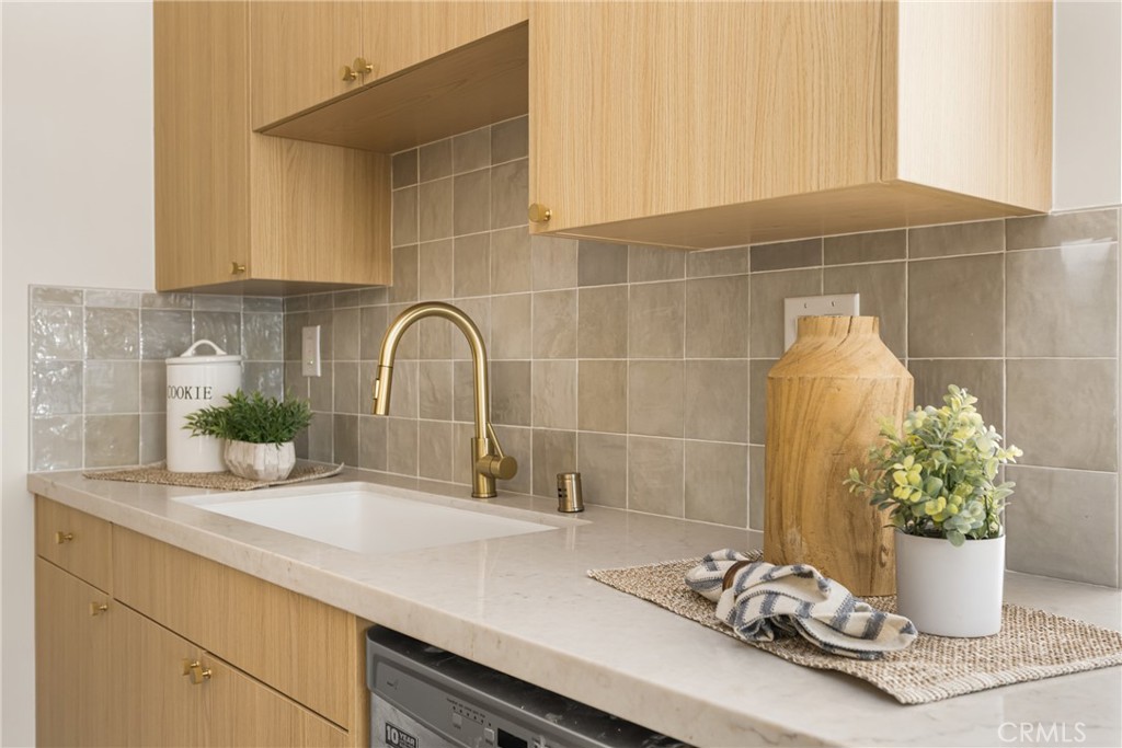 2680 Chatwin Avenue Long Beach, CA 90815 - Photo 34 of 61 a bathroom with a sink and a mirror