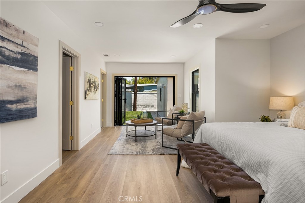 2680 Chatwin Avenue Long Beach, CA 90815 - Photo 35 of 61 a bedroom with a bed and large windows