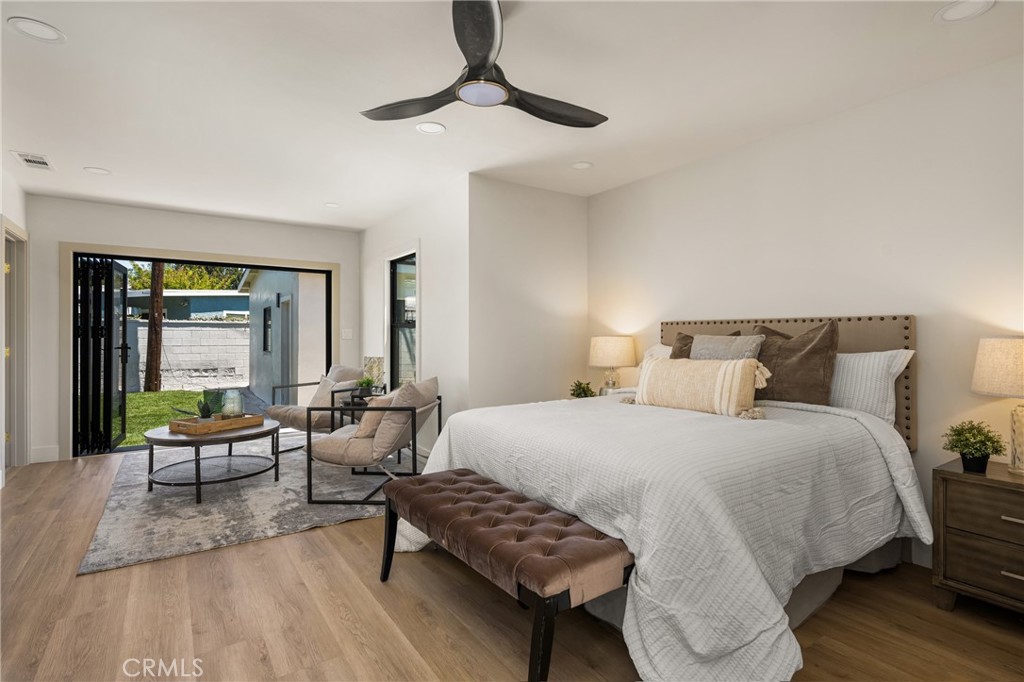 2680 Chatwin Avenue Long Beach, CA 90815 - Photo 36 of 61 a bedroom with a bed and wooden floor