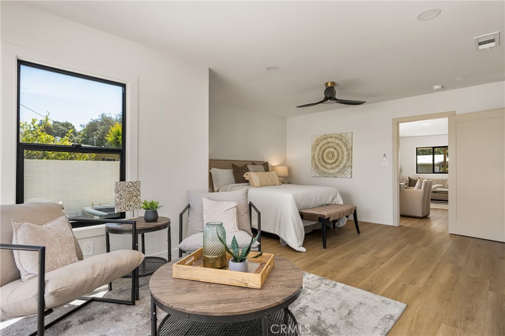 2680 Chatwin Avenue Long Beach, CA 90815 - Photo 44 of 61 a bedroom with a bed and wooden floor