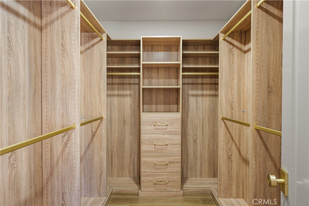 2680 Chatwin Avenue Long Beach, CA 90815 - Photo 45 of 61 a view of walk in closet with empty racks
