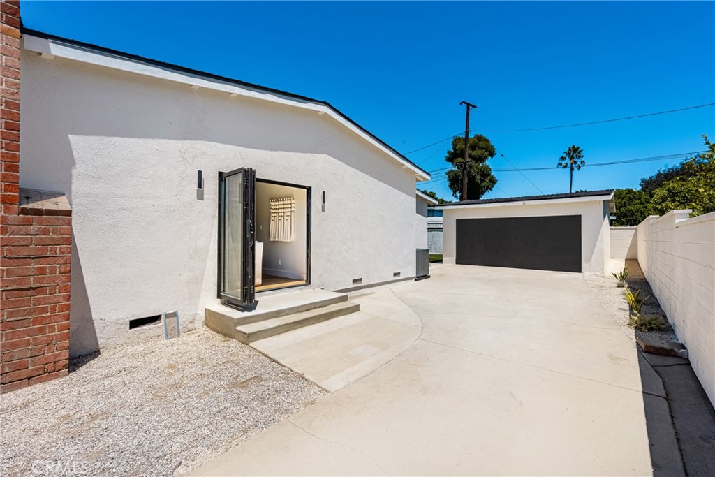2680 Chatwin Avenue Long Beach, CA 90815 - Photo 50 of 61 a front view of a house with a garage
