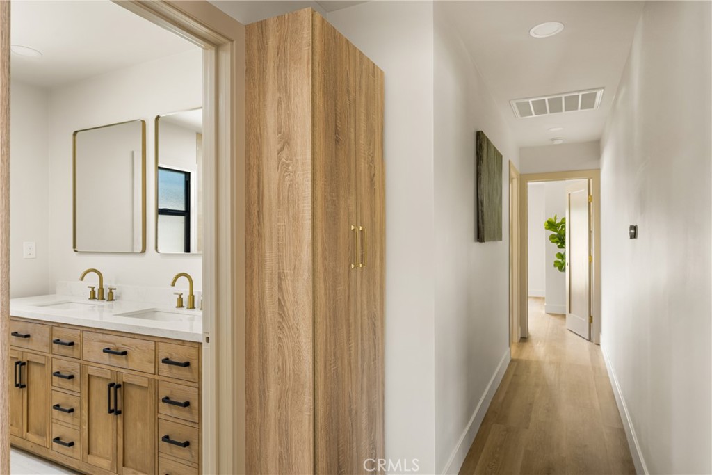 2680 Chatwin Avenue Long Beach, CA 90815 - Photo 52 of 61 a bathroom with a sink and a mirror