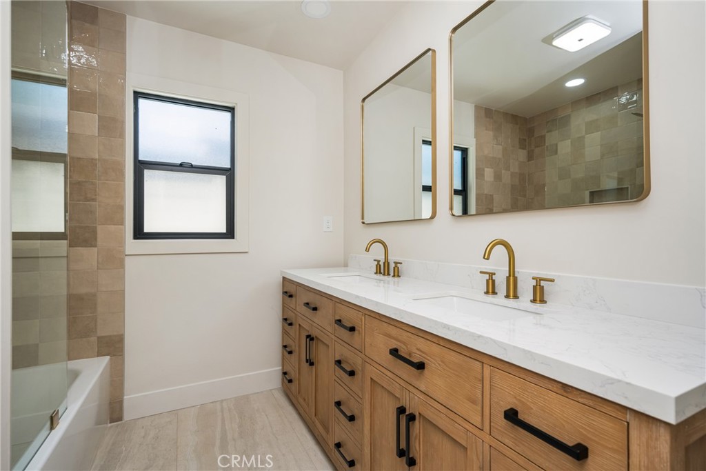 2680 Chatwin Avenue Long Beach, CA 90815 - Photo 53 of 61 a bathroom with a sink a vanity and a mirror