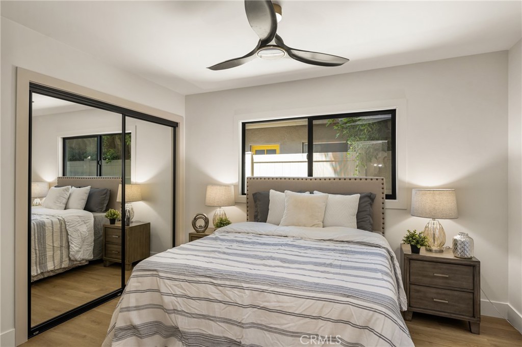 2680 Chatwin Avenue Long Beach, CA 90815 - Photo 58 of 61 a bedroom with a large bed and a chandelier