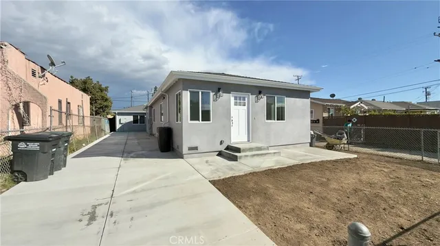 a front view of a house with parking space
