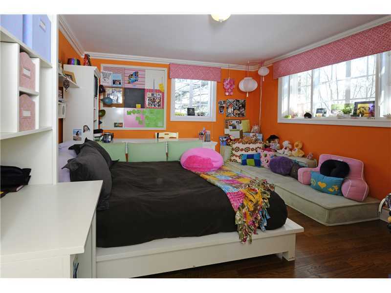 17 Copper Beech Road Greenwich, CT 06830 - Photo 13 of 16 a bedroom with two beds and a large window