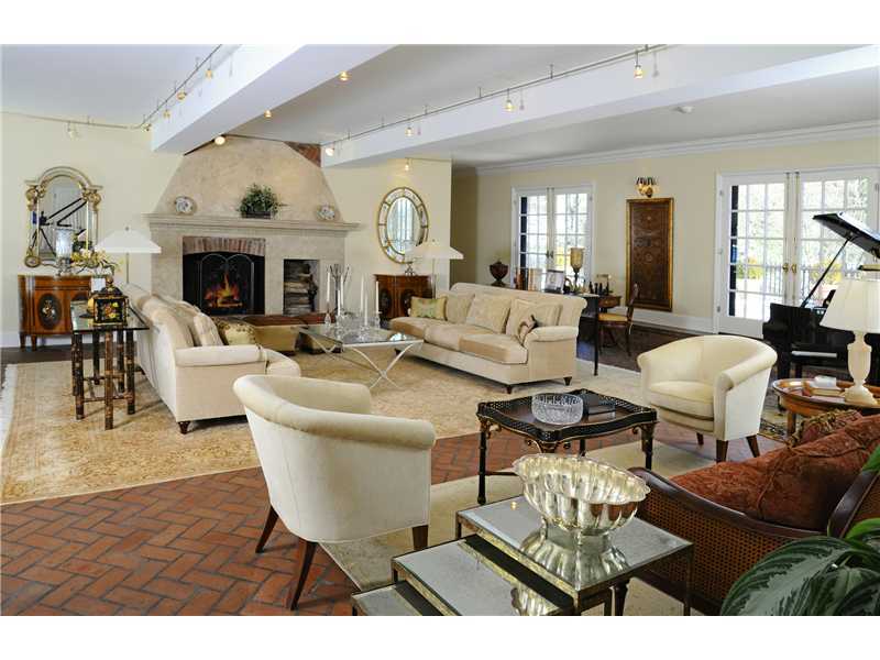 17 Copper Beech Road Greenwich, CT 06830 - Photo 3 of 16 a living room with furniture a fireplace and a flat screen tv