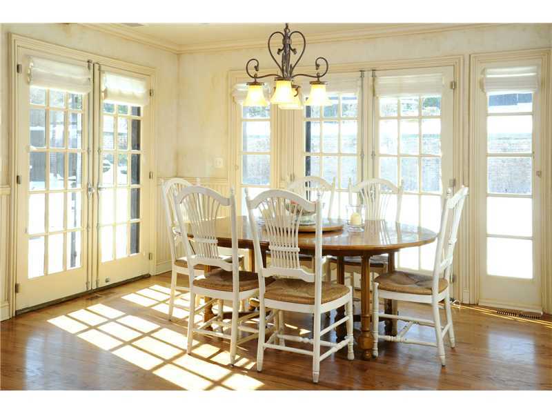 17 Copper Beech Road Greenwich, CT 06830 - Photo 7 of 16 a dining room with wooden floor and large windows
