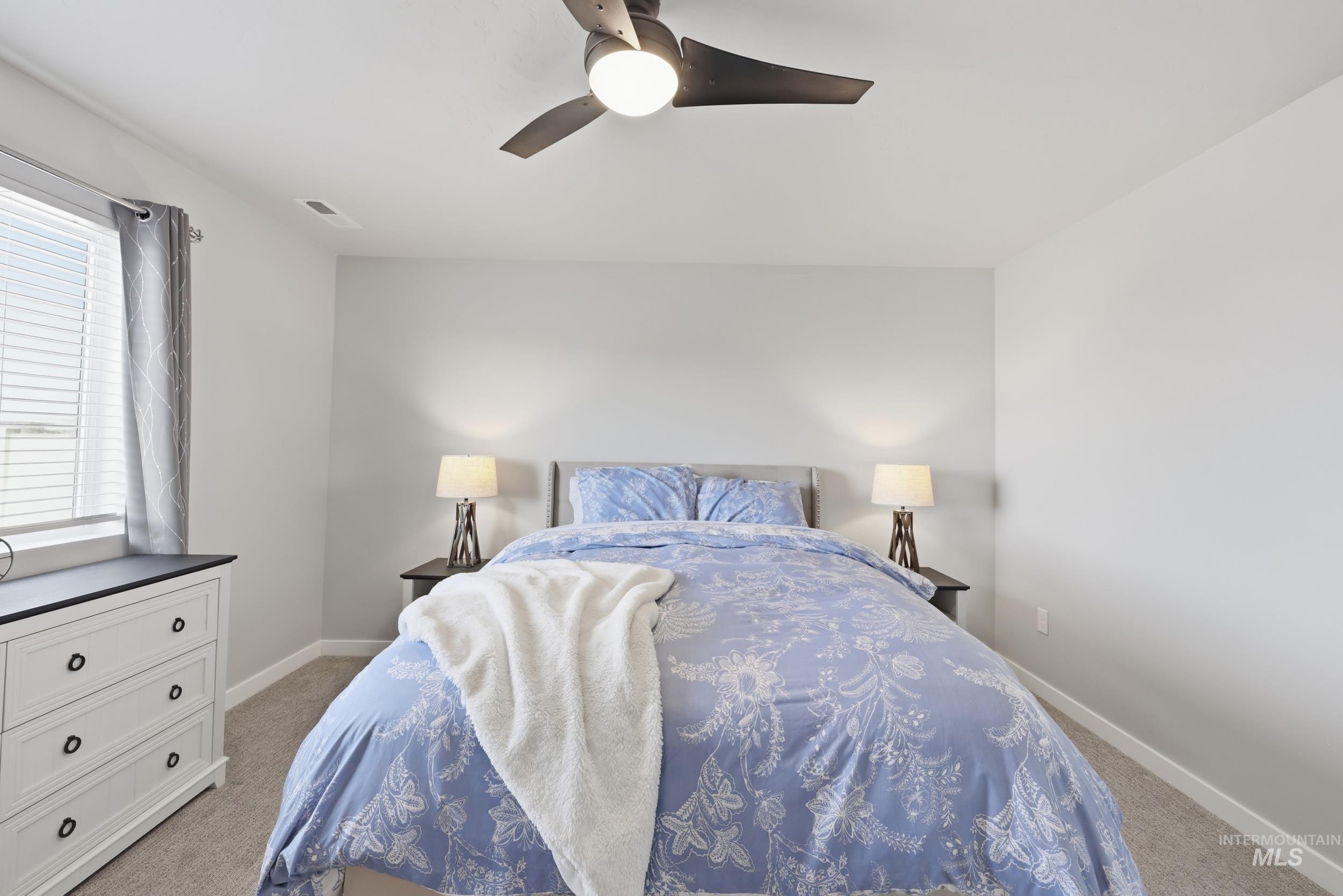 3697 W Lane Meridian, ID 83642 - Photo 22 of 44 Bedroom with light carpet and ceiling fan