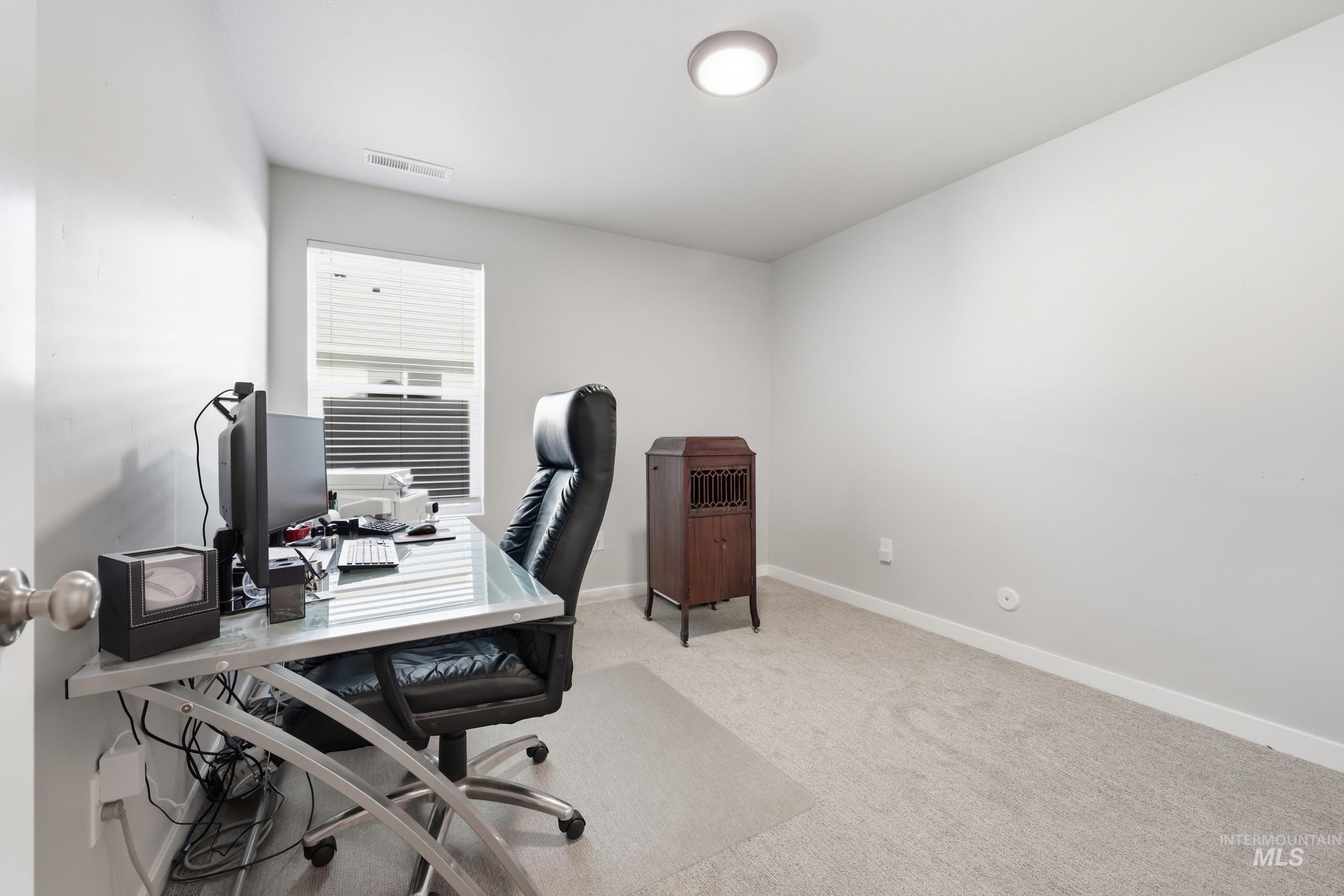 3697 W Lane Meridian, ID 83642 - Photo 30 of 44 Home office featuring light carpet and baseboards