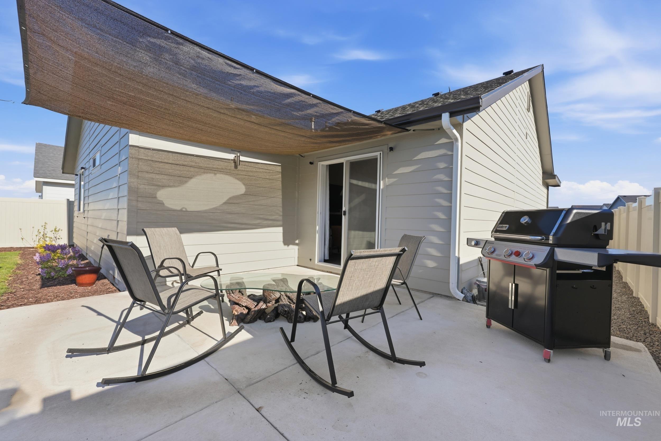 3697 W Lane Meridian, ID 83642 - Photo 33 of 44 View of patio with area for grilling and shade sail.