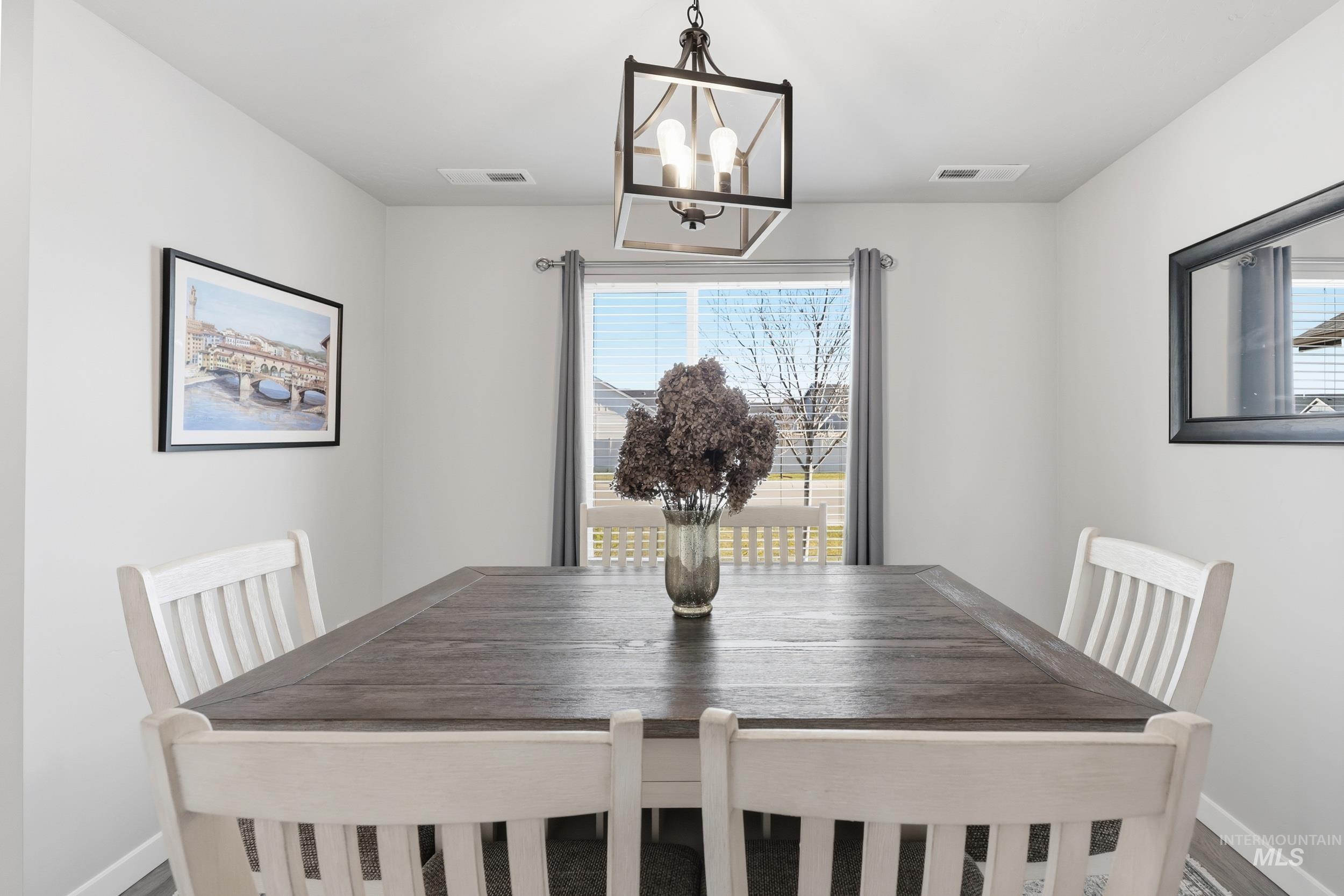3697 W Lane Meridian, ID 83642 - Photo 8 of 44 Dining area with suspended lighting and plenty of natural light