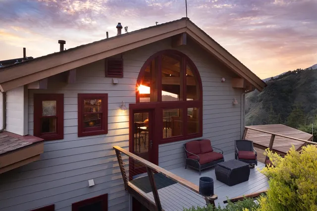 a view of a two chairs in the balcony