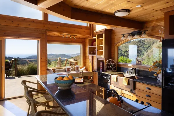 a living room with furniture large windows and a flat screen tv