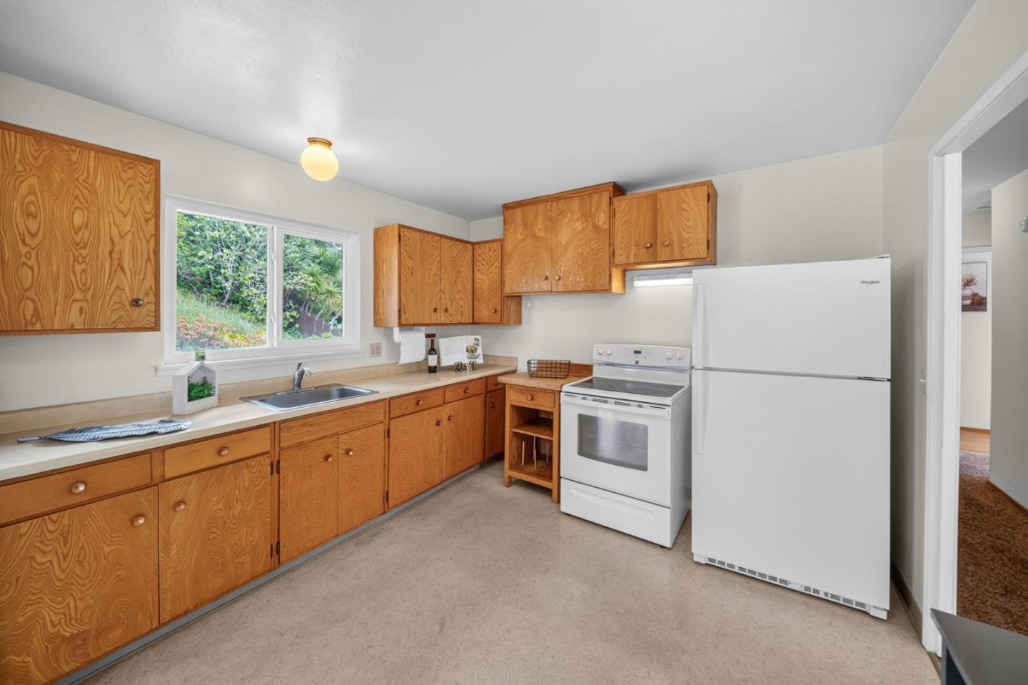 1287 Lerida Way Pacifica, CA 94044 - Photo 24 of 52 a kitchen with a white cabinets and white appliances