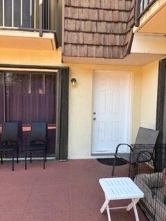 2116 21st Lane, Unit 2116 Greenacres, FL 33463 - Photo 13 of 14 a outdoor seating area with furniture