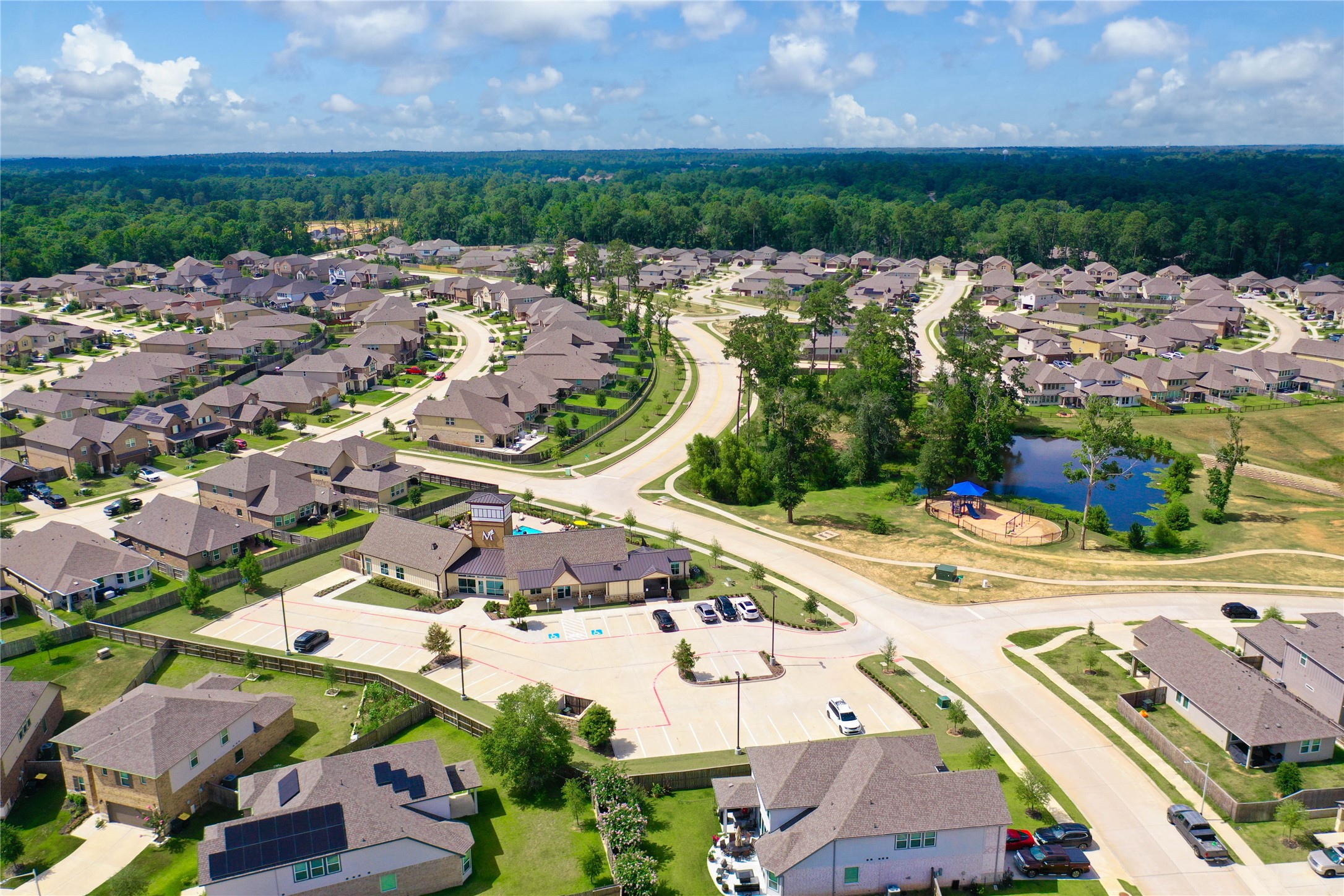 7080 Silverleaf Oak Street Conroe, TX 77304 - Photo 23 of 35 Across the street from the pool and clubhouse is the community lake and park.