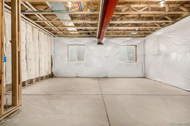 a view of a room with wooden walls
