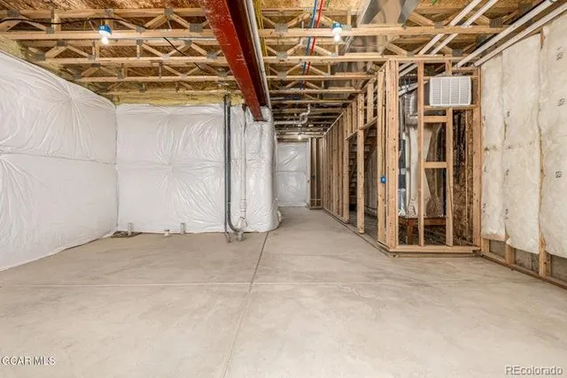 a view of a room with wooden walls