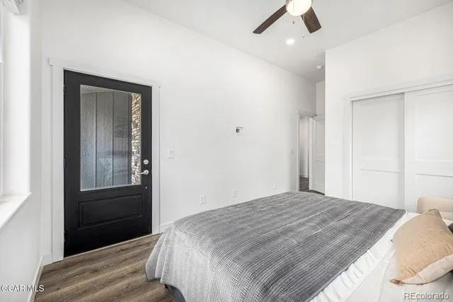 a bedroom with a bed and a walk in closet