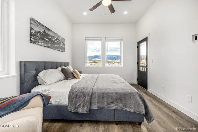 a bedroom with a bed and window