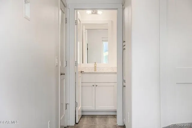 a view of bathroom with mirror