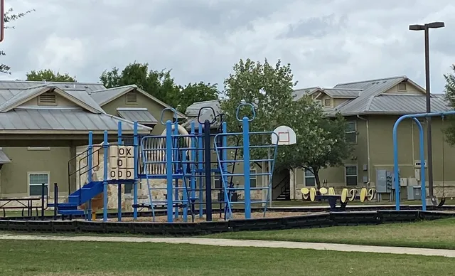 a front view of a house with a garden and plants