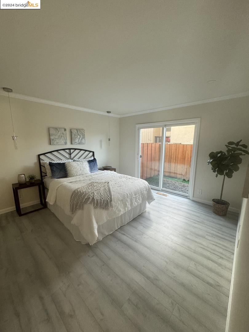 2548 Jones Road, Unit 10 Walnut Creek, CA 94597 - Photo 4 of 10 a bedroom with a large bed and a large window