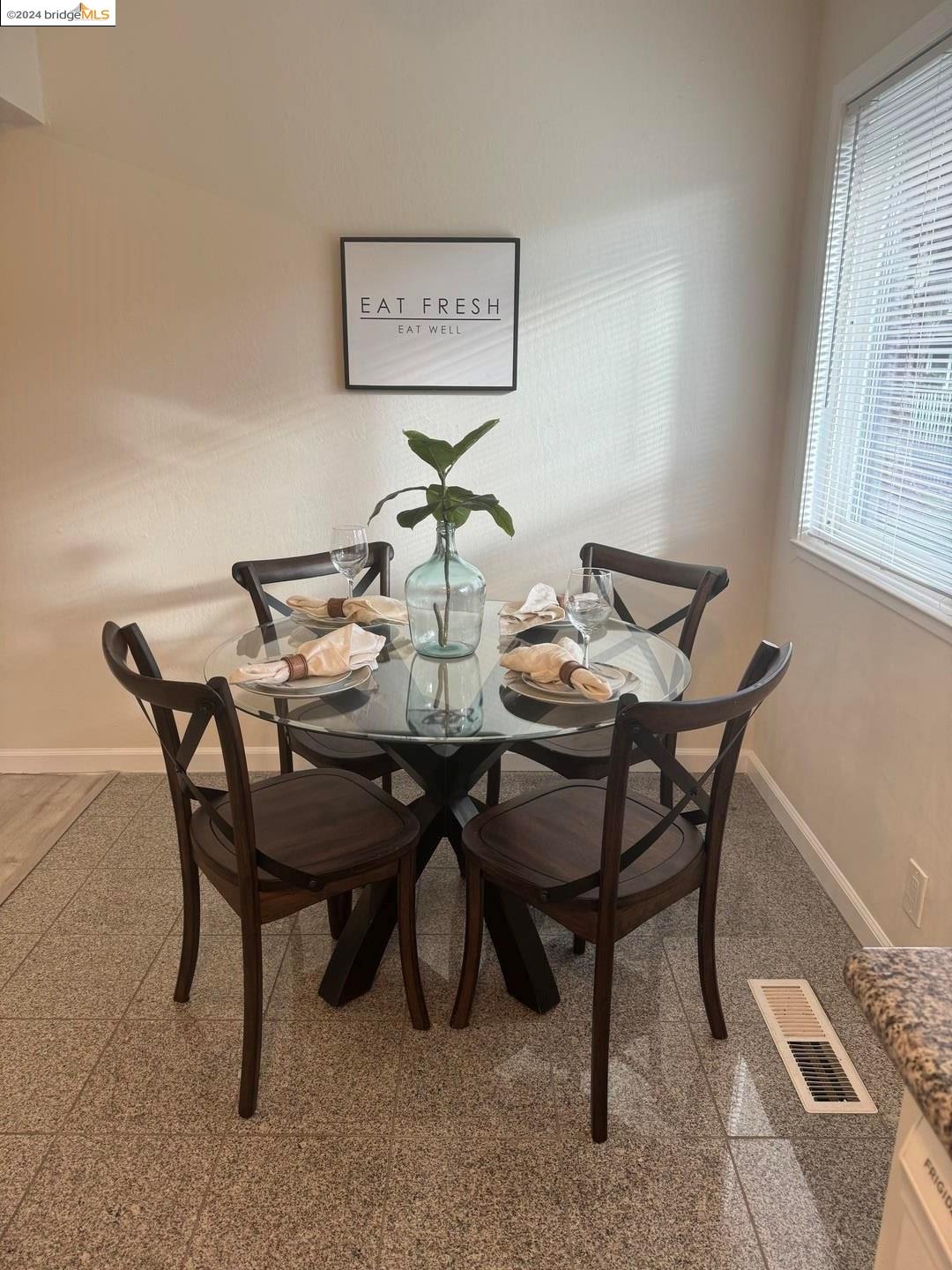 2548 Jones Road, Unit 10 Walnut Creek, CA 94597 - Photo 5 of 10 a view of a dining room with furniture and window