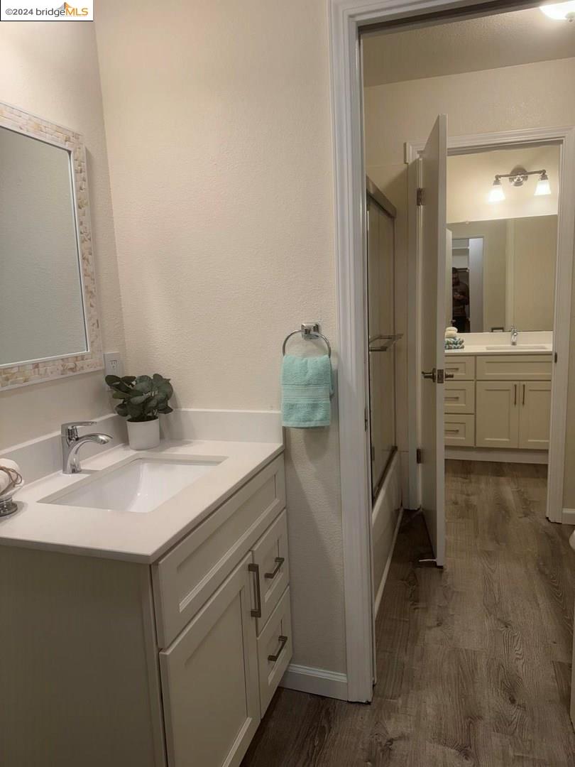 2548 Jones Road, Unit 10 Walnut Creek, CA 94597 - Photo 7 of 10 a bathroom with a sink and mirror