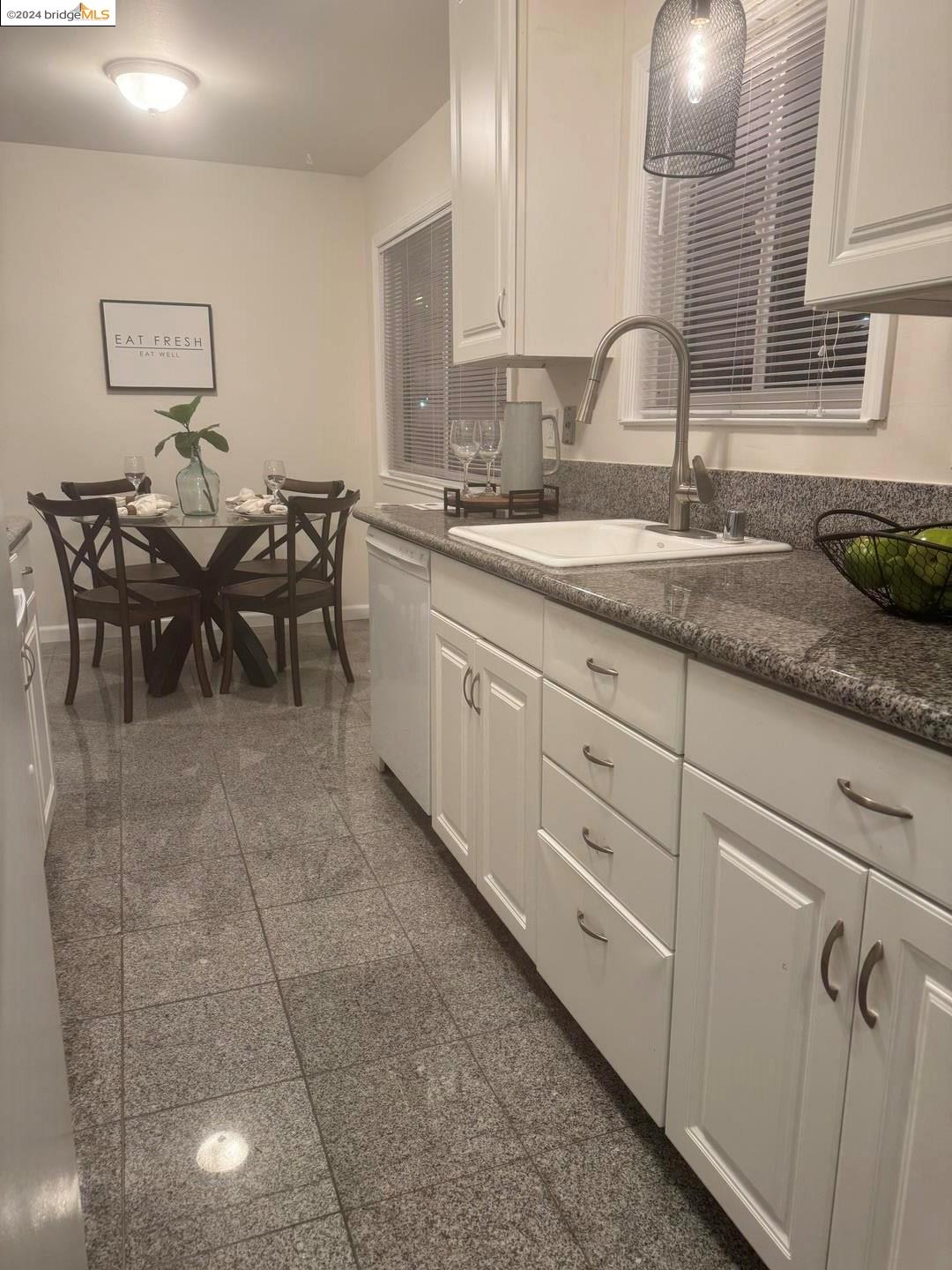 2548 Jones Road, Unit 10 Walnut Creek, CA 94597 - Photo 10 of 10 a open kitchen with granite countertop a sink and white cabinets