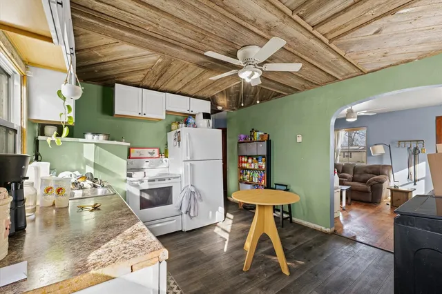 a living room filled with furniture and a chandelier