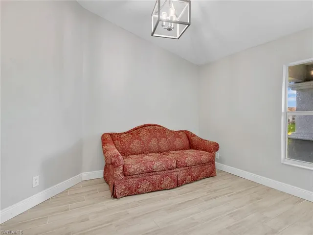 a blue couch sitting on top of a room