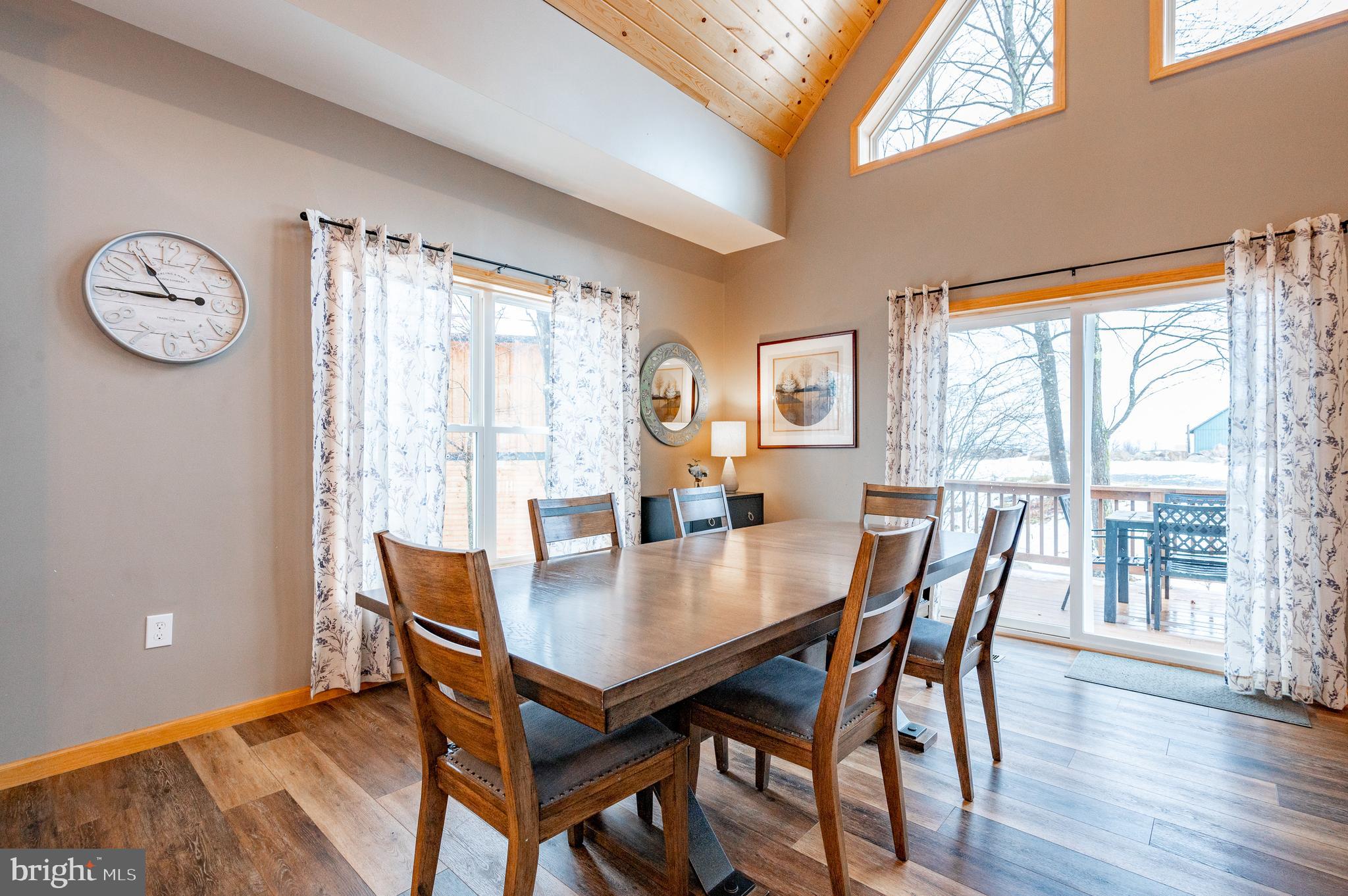 226 Wisp Adventure Road McHenry, MD 21541 - Photo 12 of 67 a view of a dining room with furniture window and wooden floor