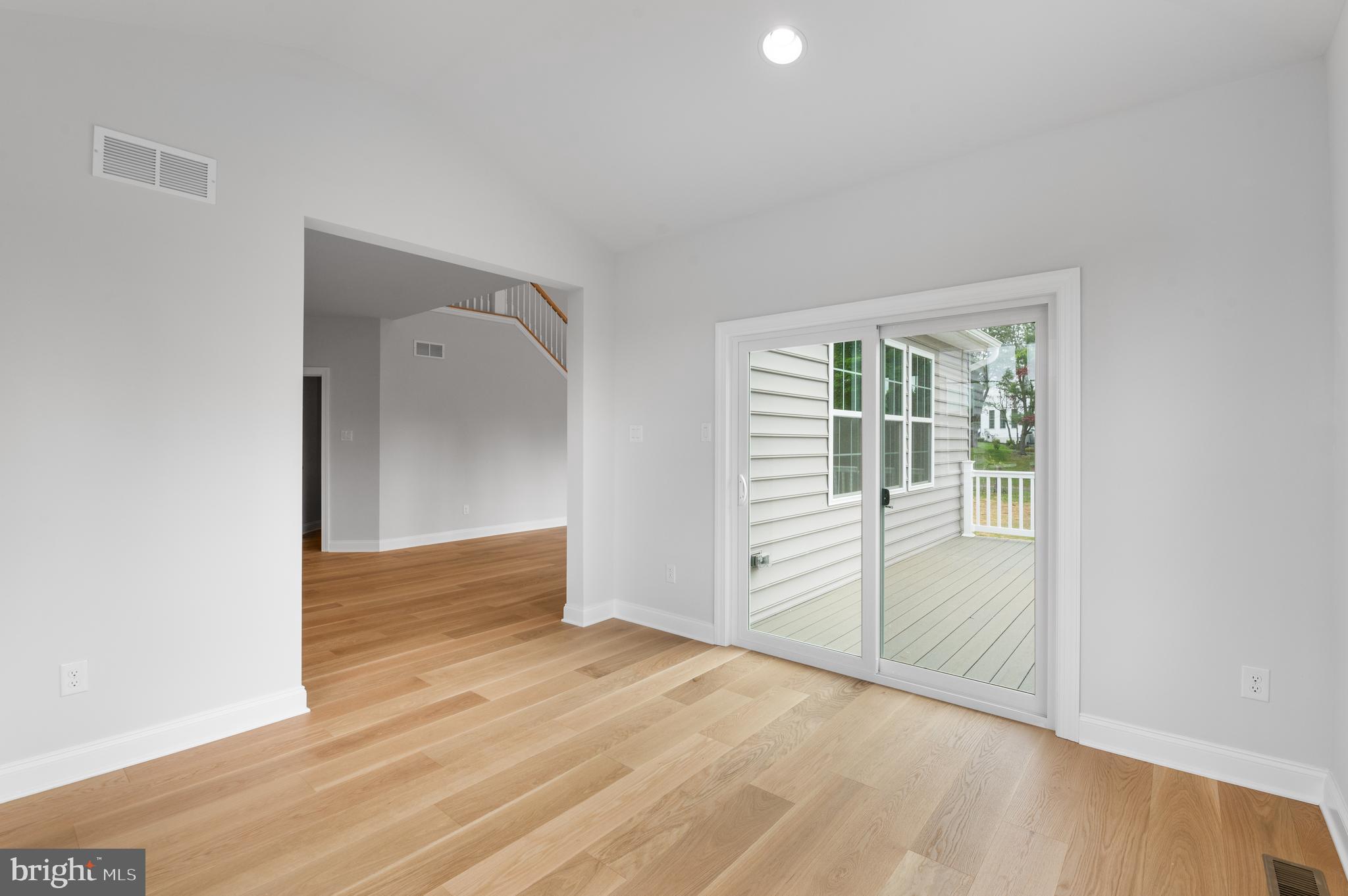 1104 Arden Drive, Unit METHACTON Norristown, PA 19403 - Photo 23 of 40 an empty room with wooden floor and windows