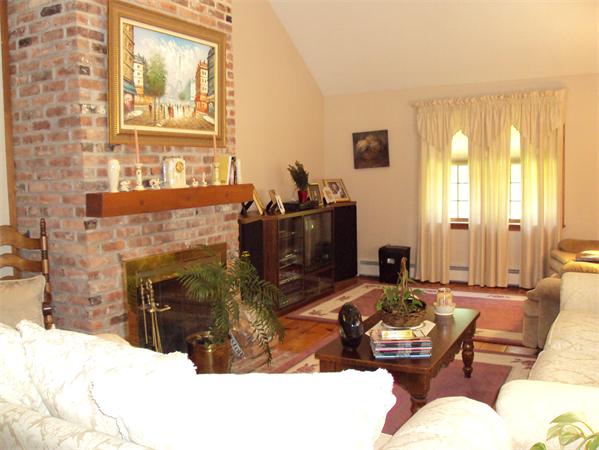 1 Elliott Road Sterling, MA 01564 - Photo 5 of 23 a living room with furniture windows and a fireplace