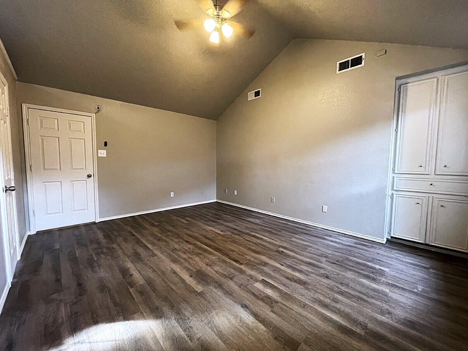 6328 10th Street Lubbock, TX 79416 - Photo 17 of 25 a view of empty room with wooden floor