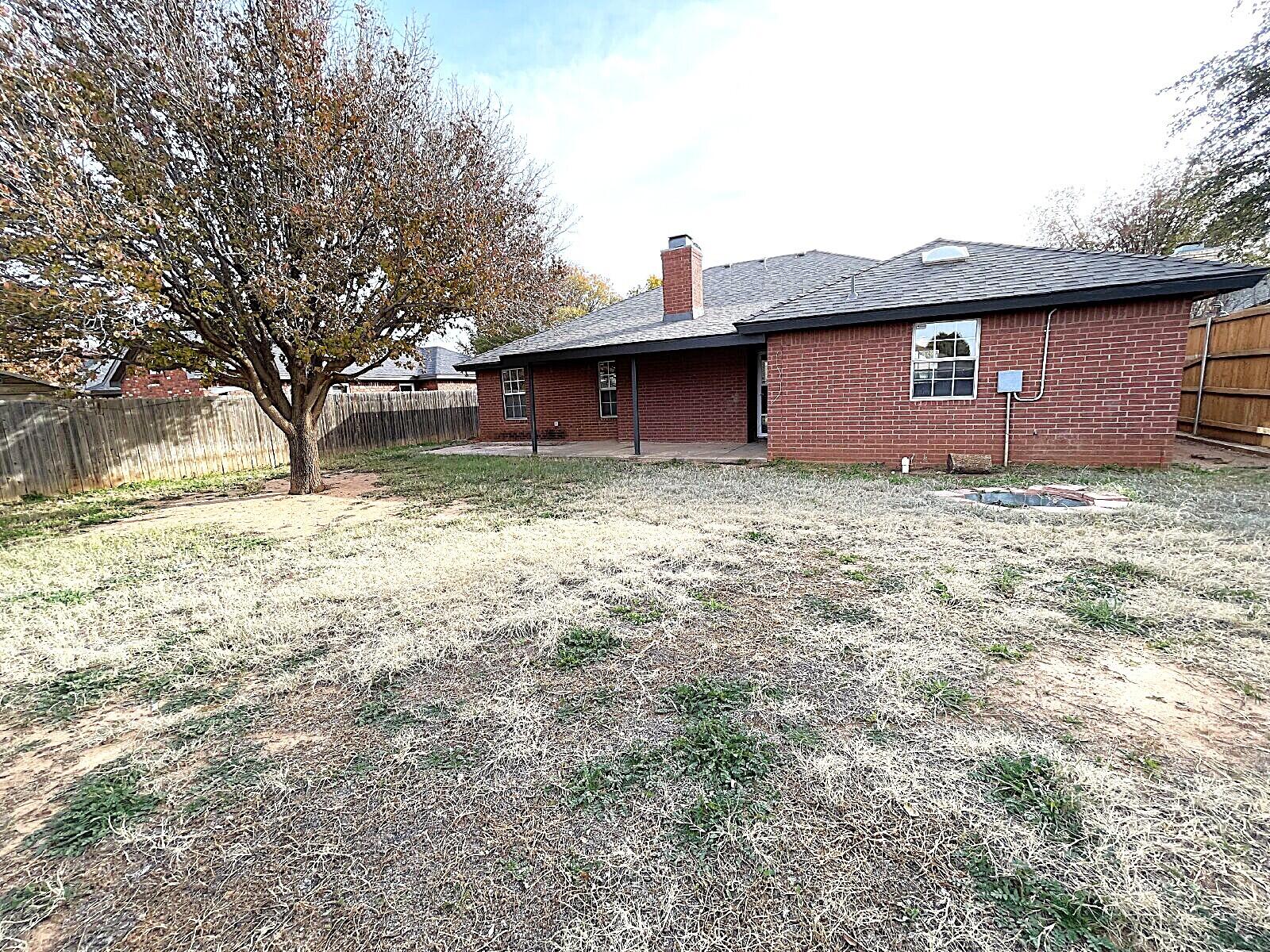 6328 10th Street Lubbock, TX 79416 - Photo 24 of 25 a view of a yard with wooden fence