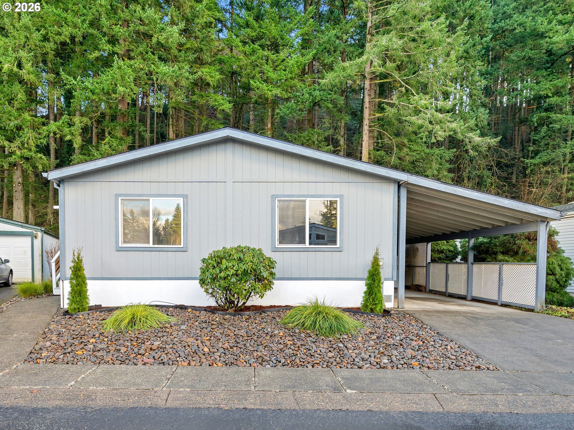a view of a house with a yard and plants