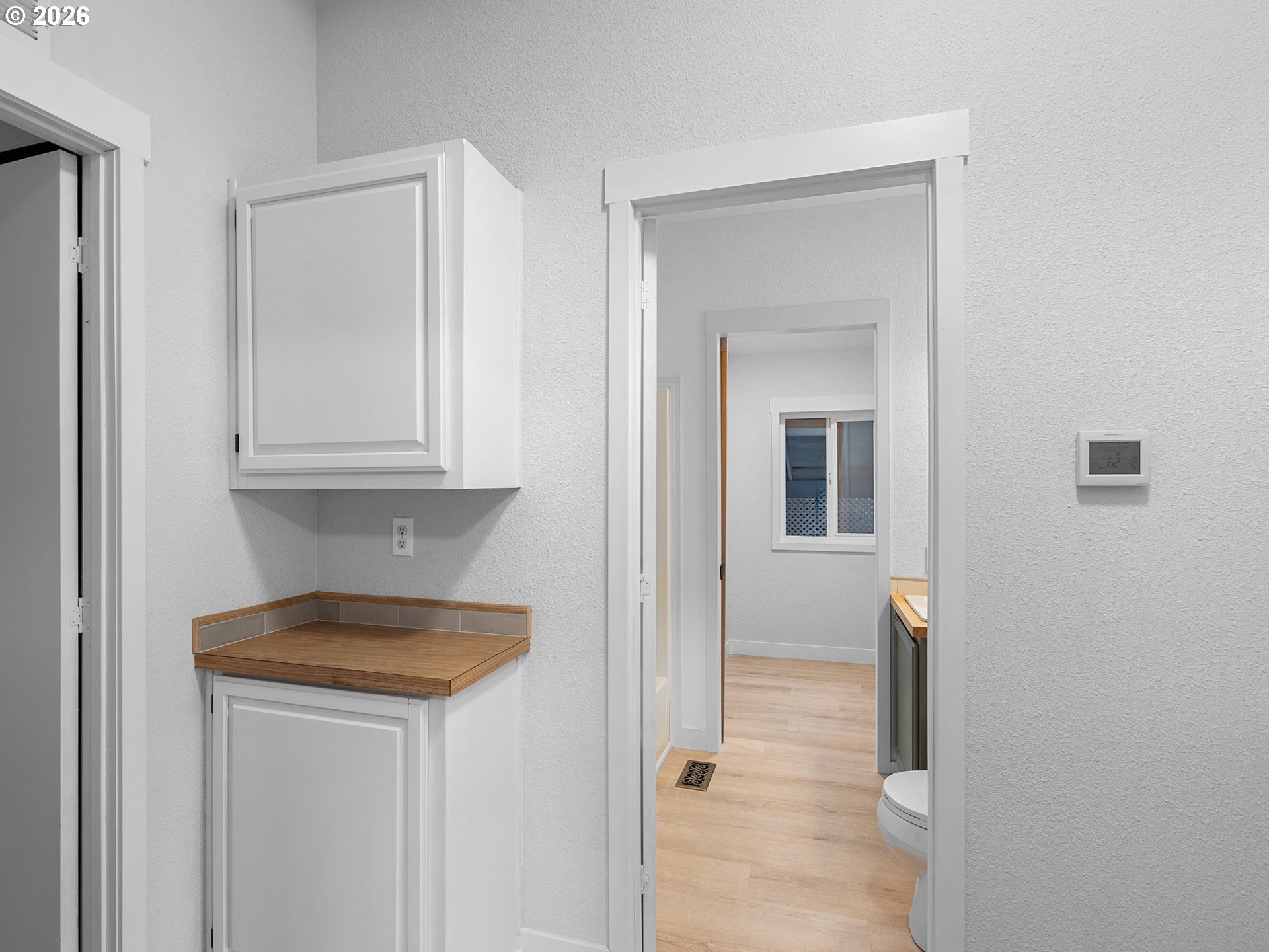 15768 Southeast Powell Boulevard, Unit 12 Portland, OR 97236 - Photo 20 of 31 a view of hallway with washer and dryer