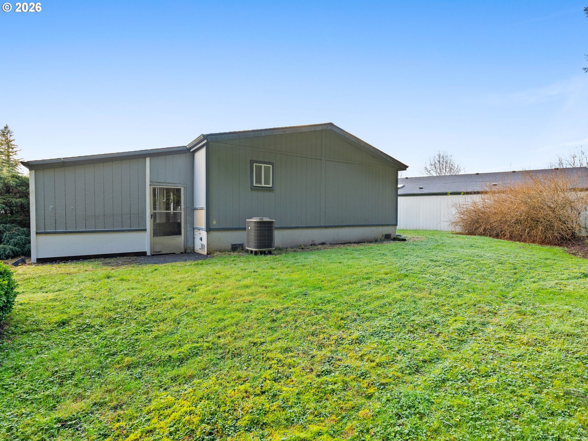 15768 Southeast Powell Boulevard, Unit 12 Portland, OR 97236 - Photo 28 of 31 a backyard of a house