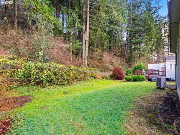 a backyard of a house with lots of green space