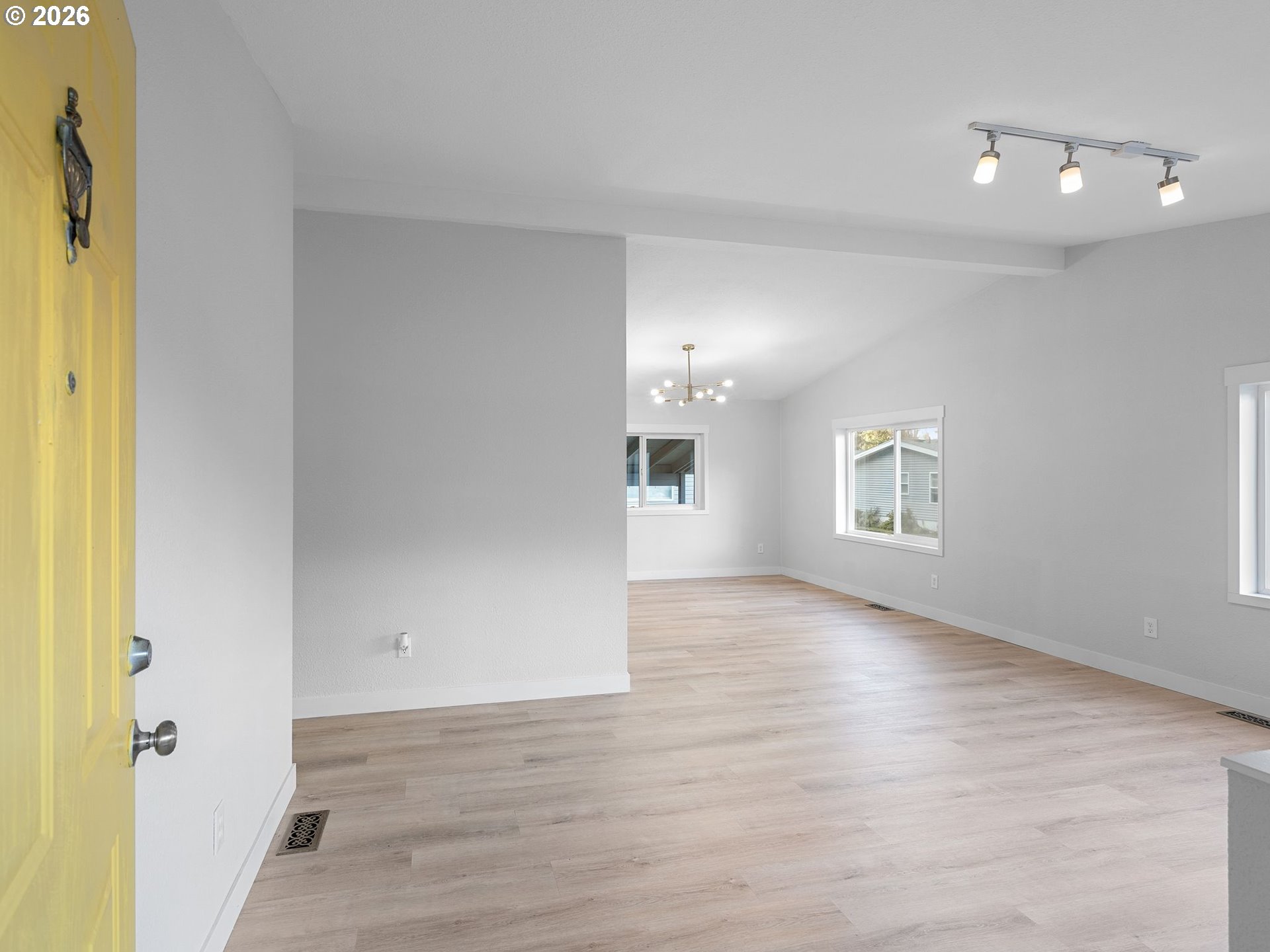 15768 Southeast Powell Boulevard, Unit 12 Portland, OR 97236 - Photo 5 of 31 a view of empty room with wooden floor and fan