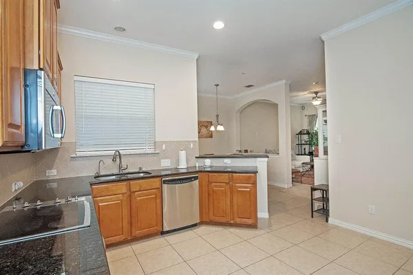 a kitchen with a sink and cabinets