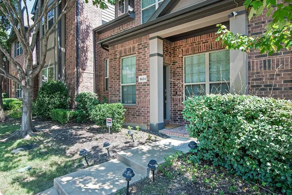 a view of a house with a garden
