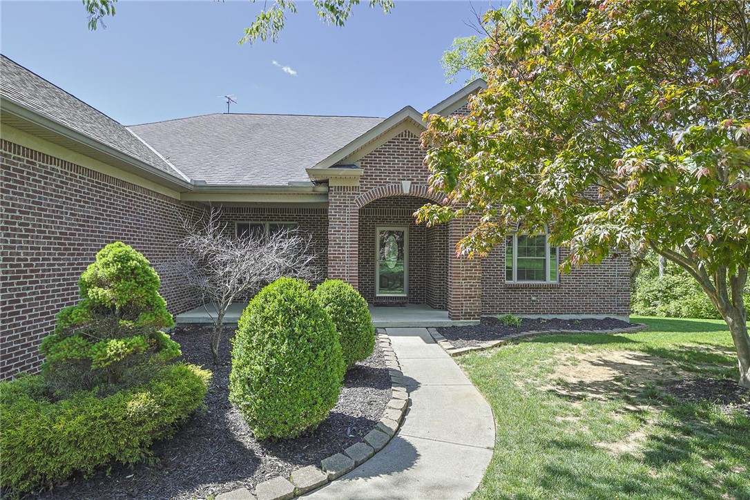 3681 Wilmington Road Lebanon, OH 45036 - Photo 2 of 87 This classic brick residence features a welcoming arched entry, mature landscaping, and an inviting walkway.